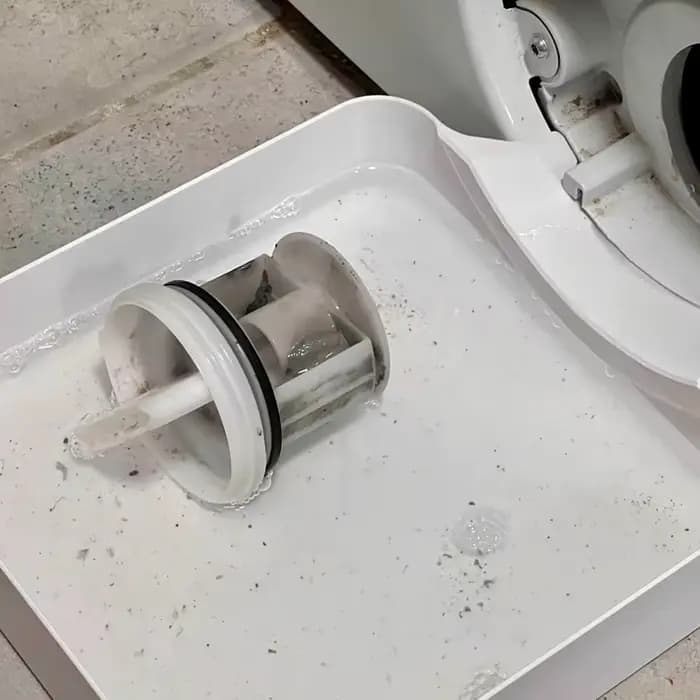 Bac de nettoyage du filtre de machine à laver : récupère l'eau résiduelle et les taches de peluches
