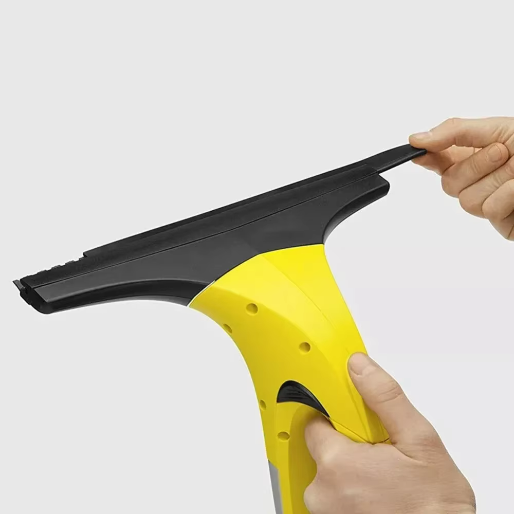 Machine de nettoyage de vitres avec bande de caoutchouc